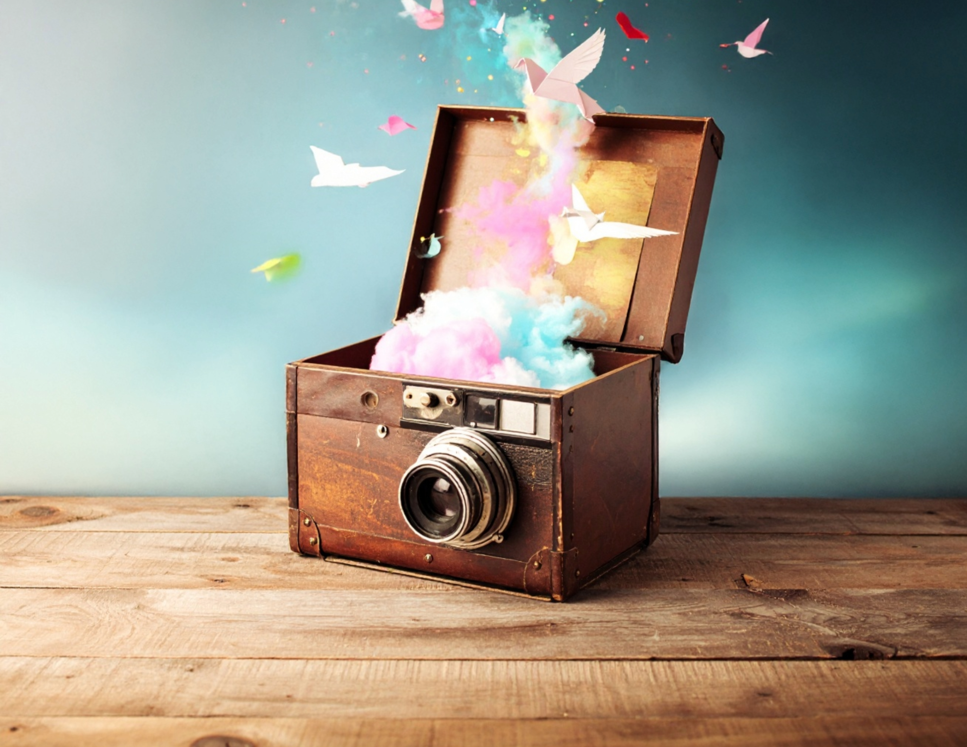 Camera with creative elements bursting out.